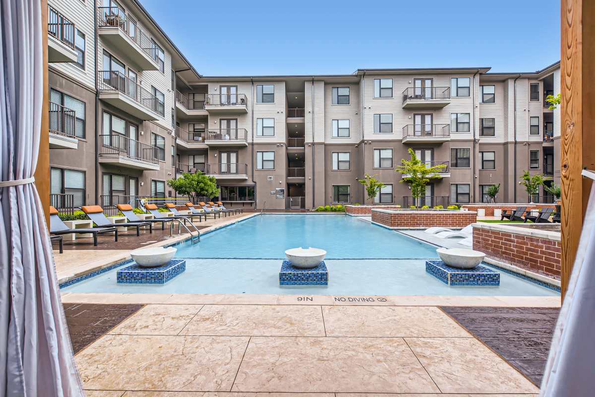 Spacious resort-style swimming pool at Factory Design District in Dallas, Texas