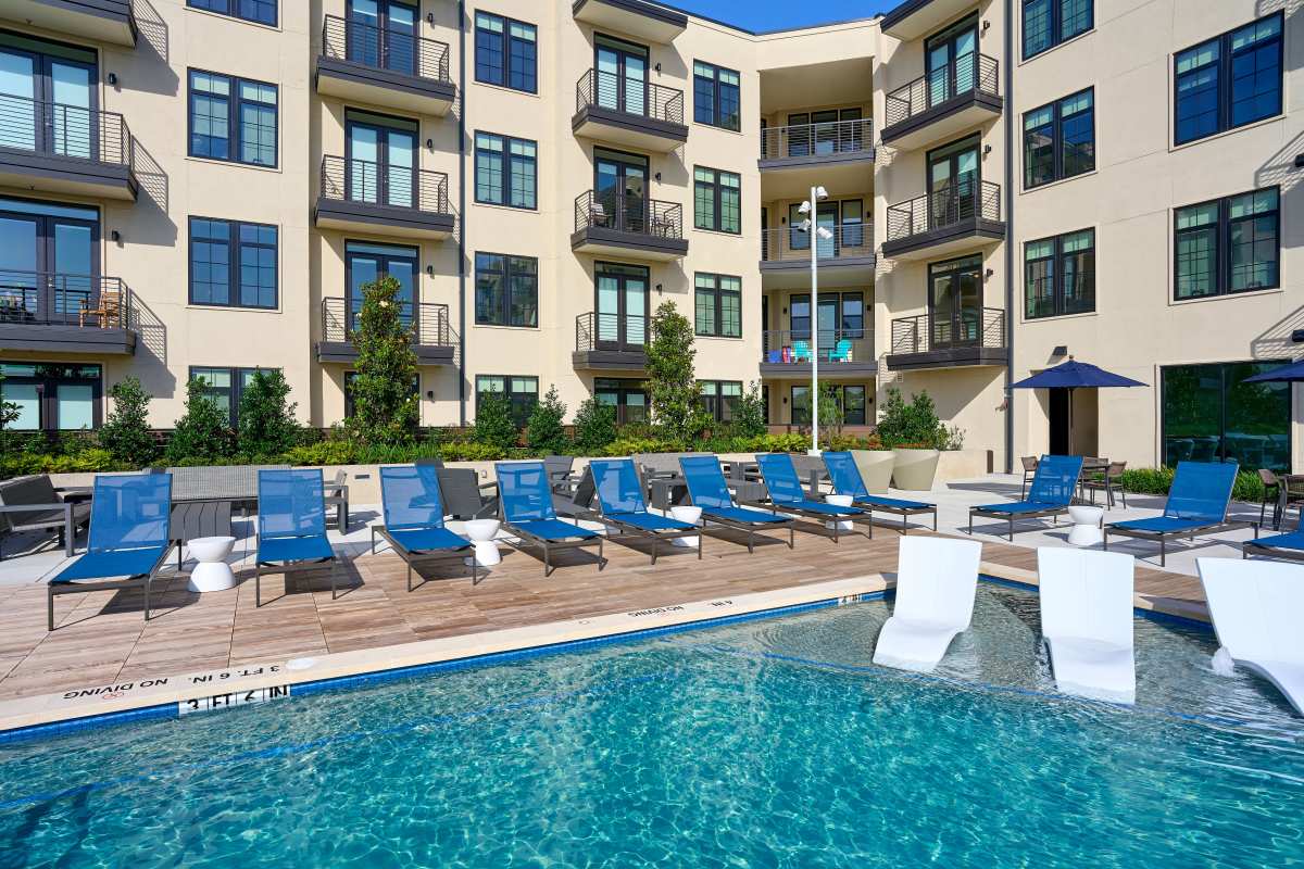 Women playing in pool with her daughter at Pearl Lofts in Dallas, Texas
