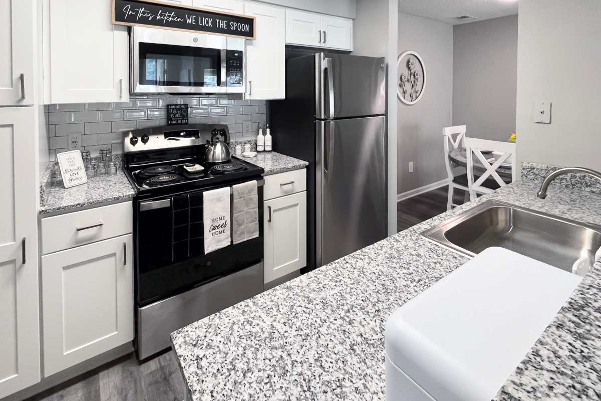 Updated and modern kitchen with stainless steel appliances at Trinity Lakes in Cordova, Tennessee