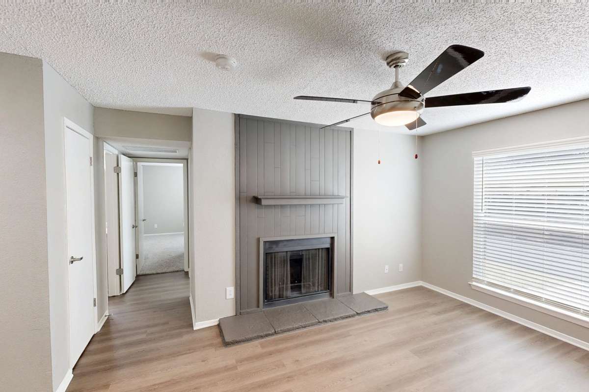 Resident living space with a fireplace at Creekside in San Angelo, Texas