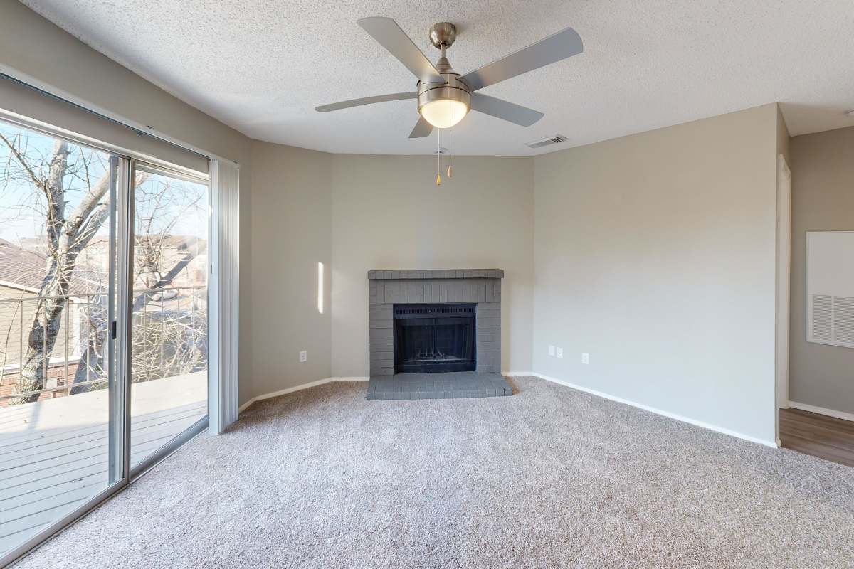 Resident living area with fireplace and natural light at Hunters Glen in Killeen, Texas