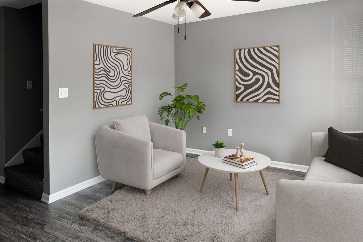 Model living area with stairs at Willow Creek Townhomes in Jonesboro, Arkansas