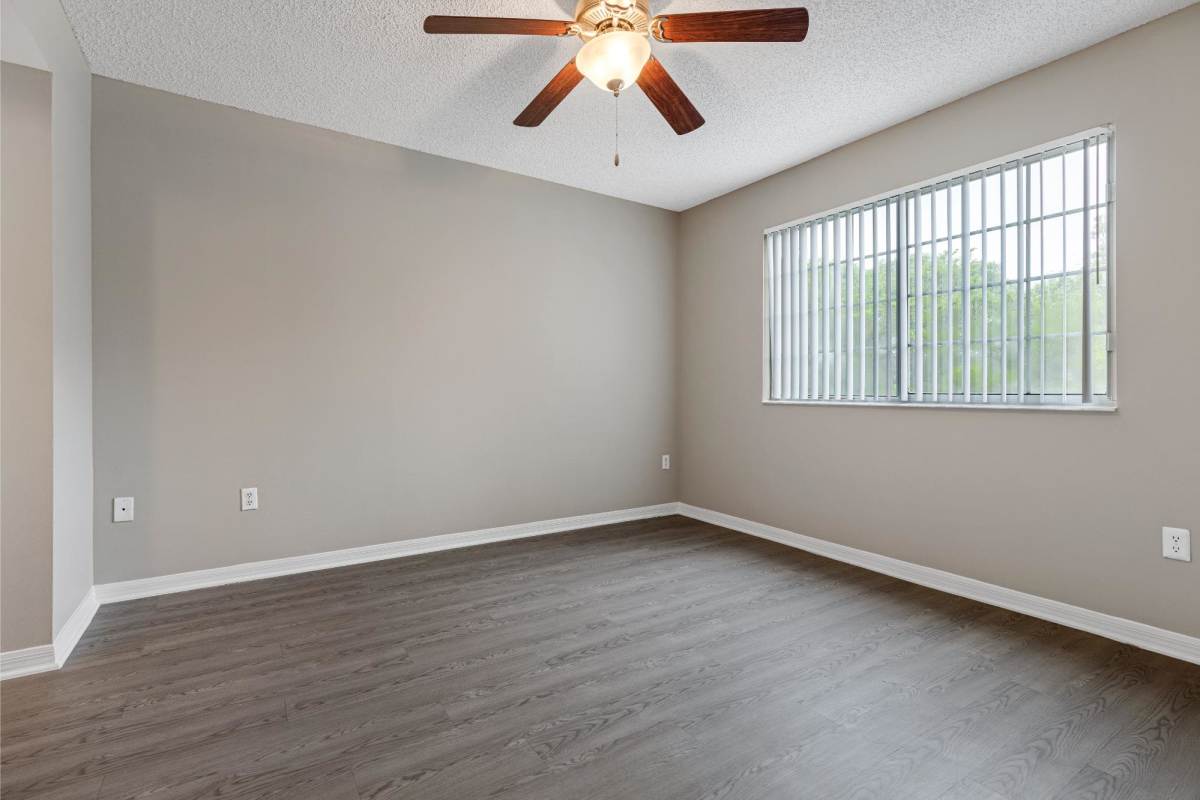 Bedroom with large window at The Allara Apartments, Boynton Beach, Florida
