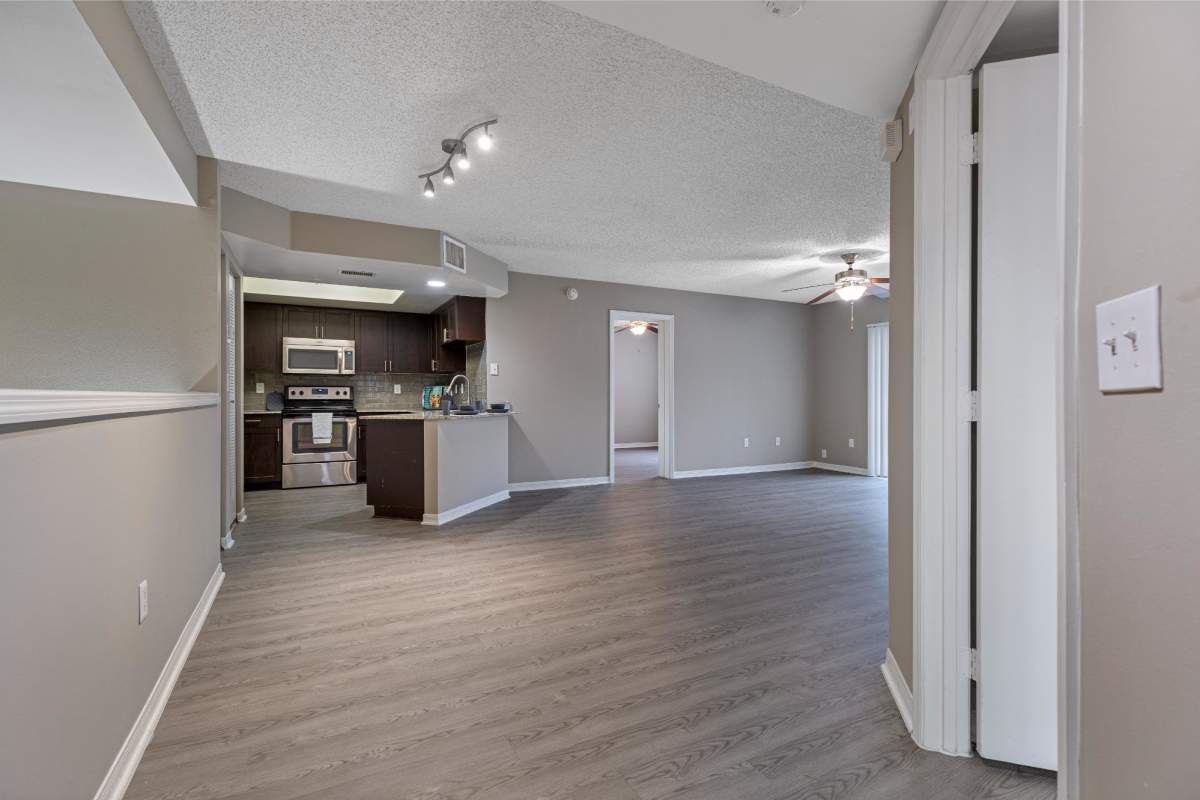 Unfurnished dining area with view to kitchen at The Allara Apartments, Boynton Beach, Florida