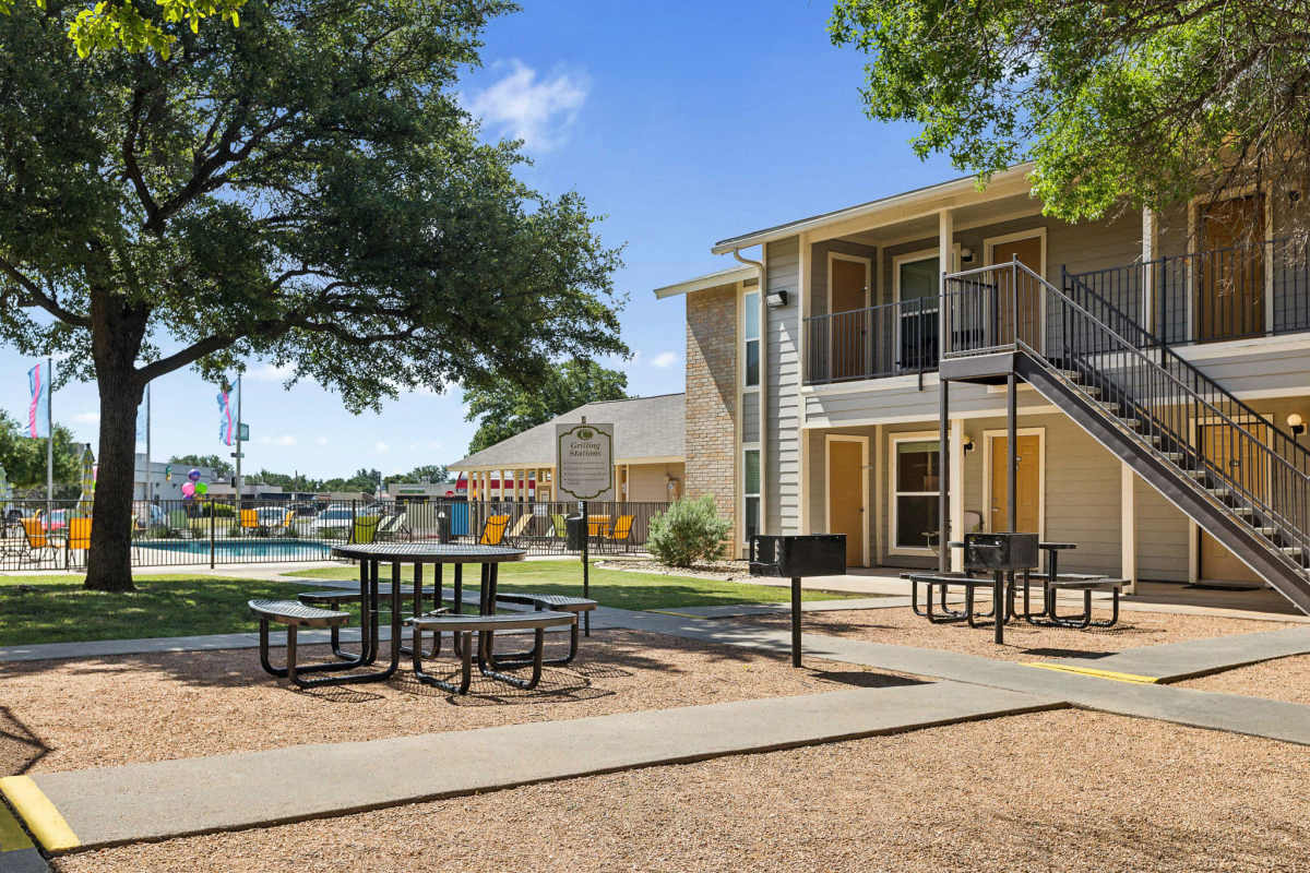 Picnic and grilling area with grill stations and seating at Creekside in San Angelo, Texas