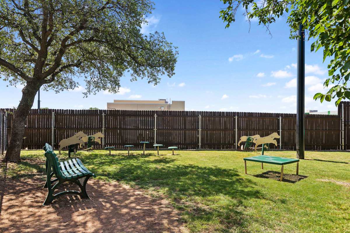Gated pet park with seating at Creekside in San Angelo, Texas