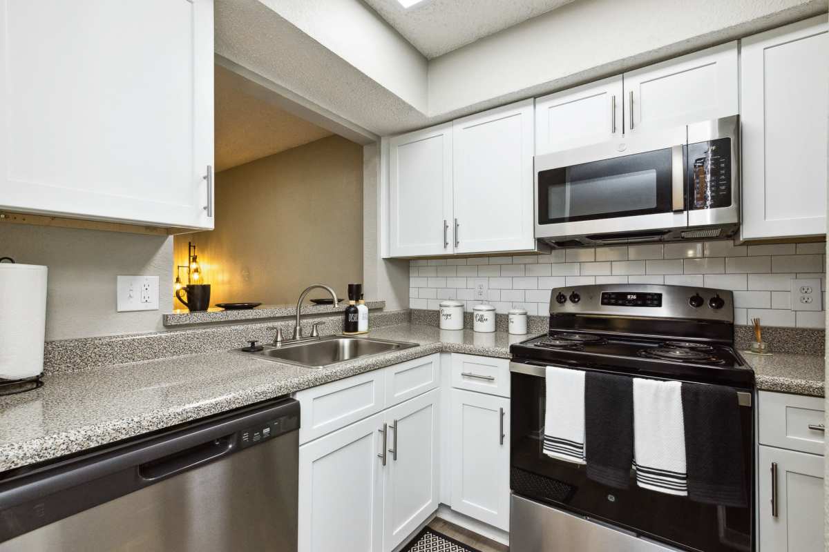 Model kitchen with stainless steel appliances at Creekside in San Angelo, Texas