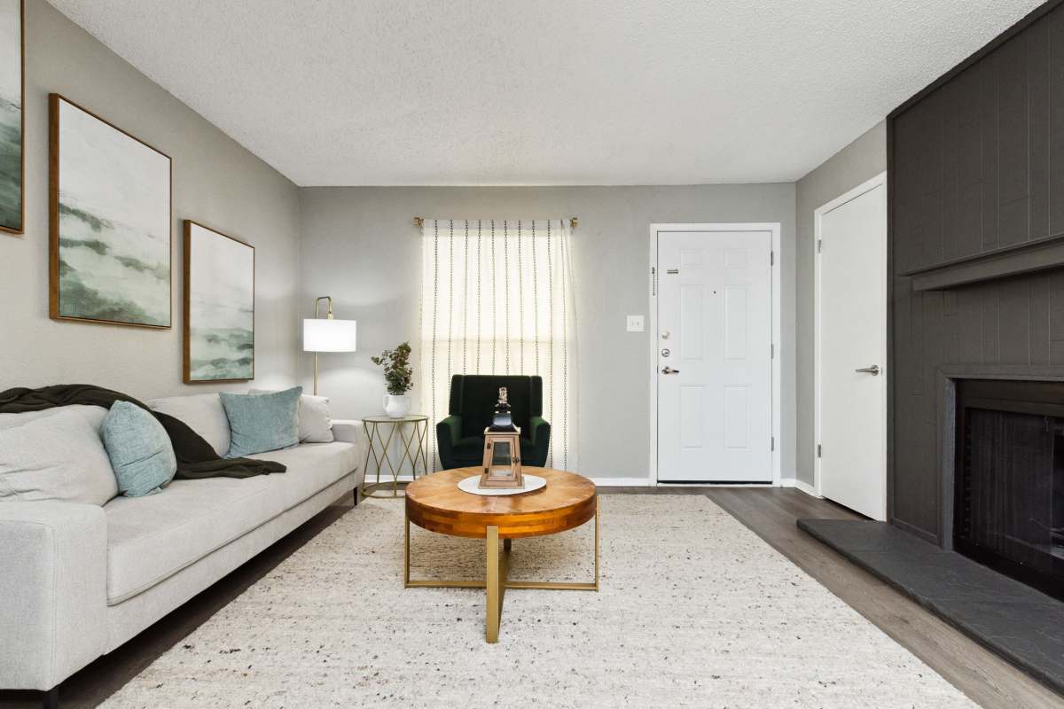 Model living space with fireplace at Creekside in San Angelo, Texas