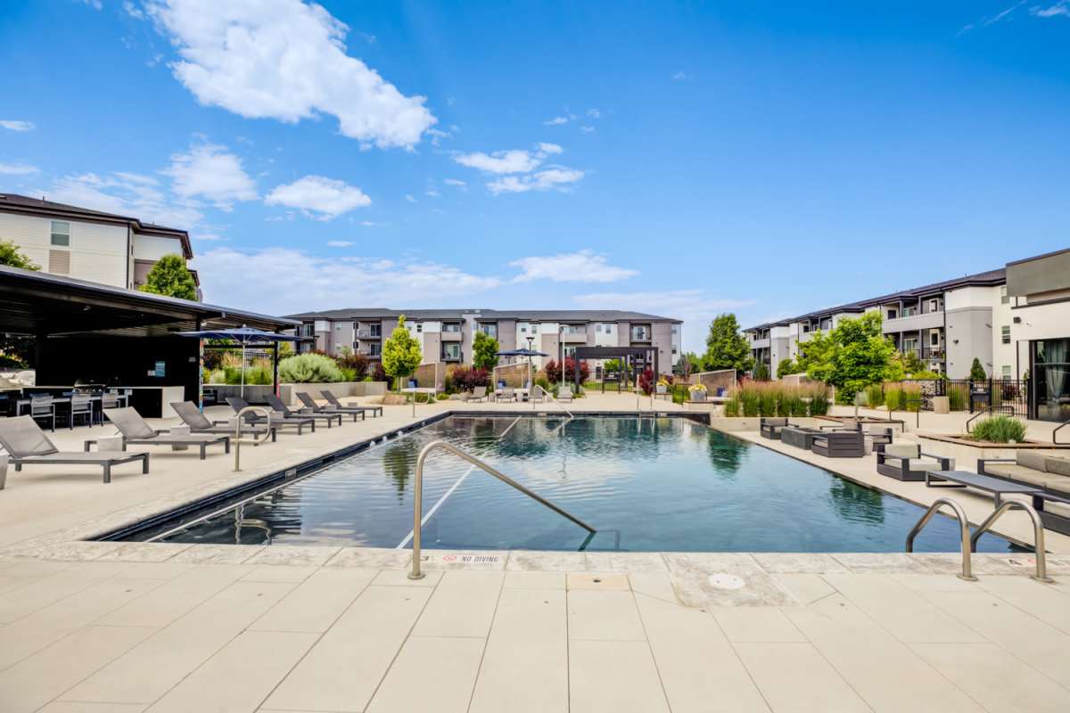 Waterfall-style Swimming Pool at The Wyatt Apartments in Fort Collins, Colorado