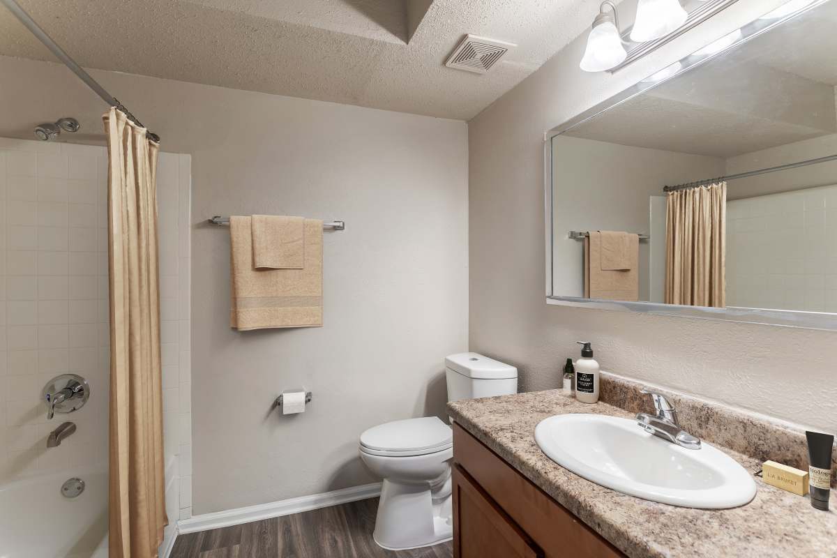 Affordable Antioch, TN apartments bathroom with vanity, tub and toilet – Hickory Lake offers pet-friendly 1, 2, and 3 bedroom rentals.