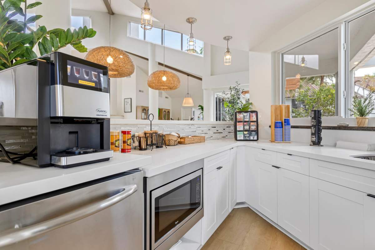 Apartment kitchen with white cabinetry at Centro at Davie Apartments in Davie,Florida