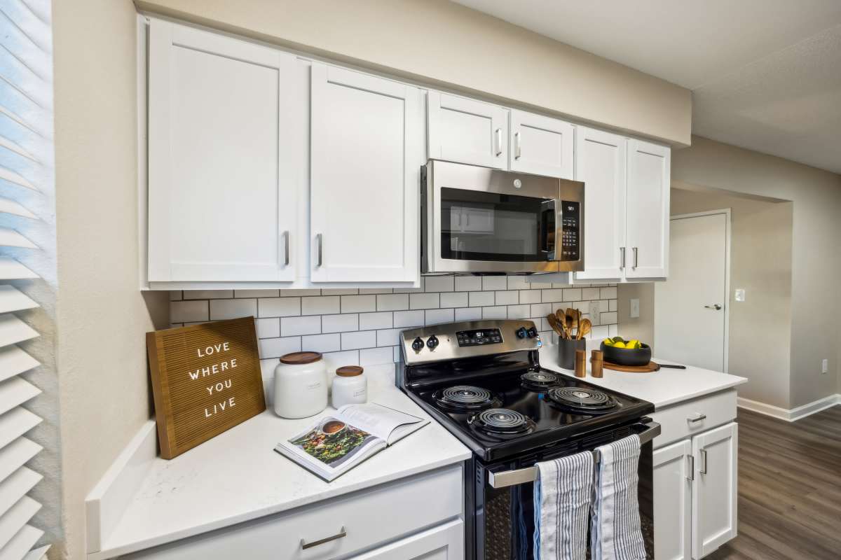 Modern kitchen with updated appliances at Cypress Pointe in Louisville, Kentucky