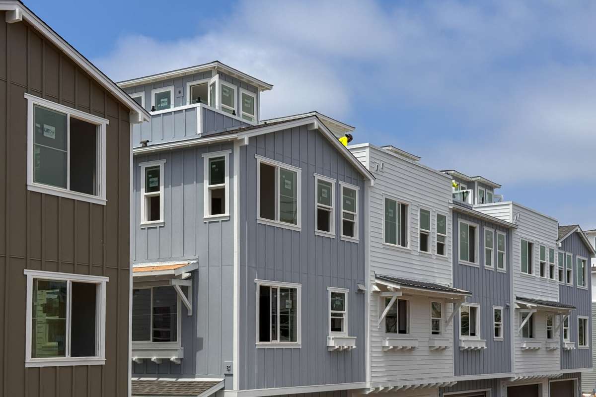 Exterior of the white homes at Tower24 Ponto Beach in Carlsbad, California