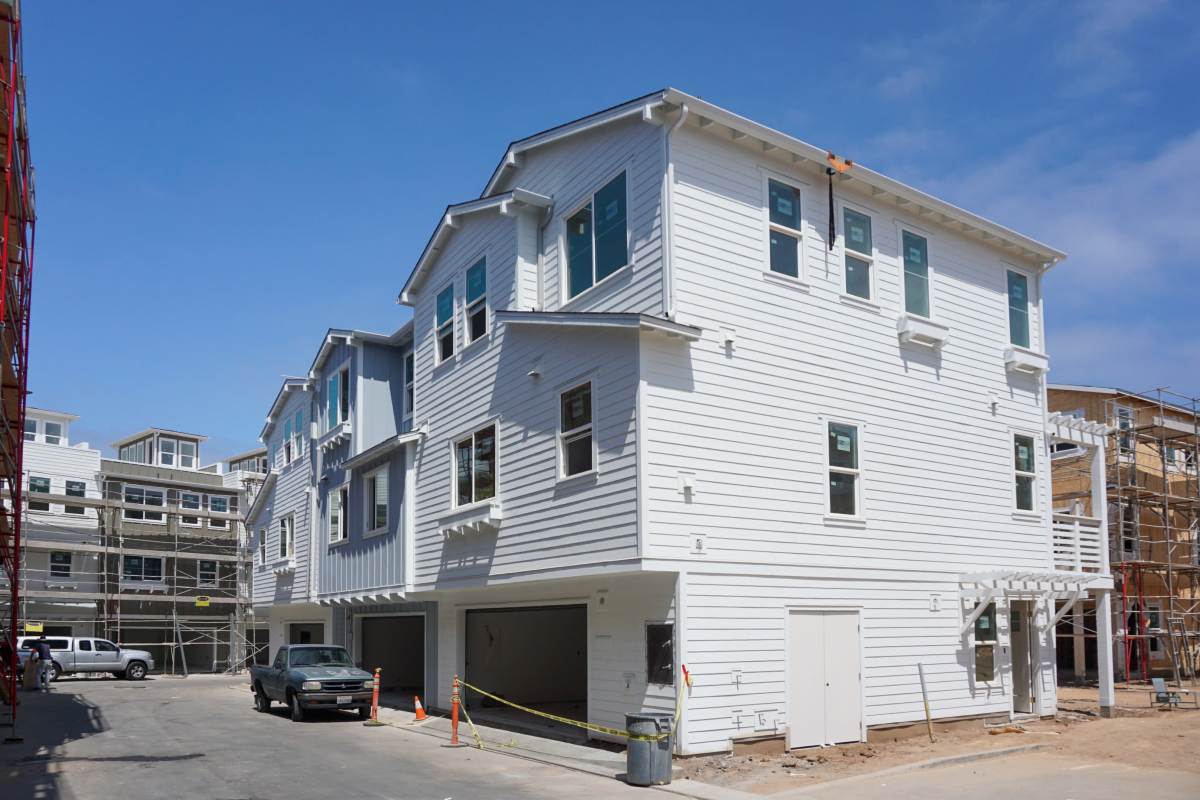 Exterior of the building with a car garage at Tower24 Ponto Beach in Carlsbad, California