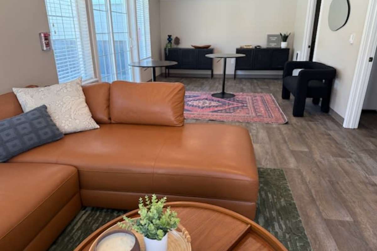 Community area with beautiful wall at Chinook Way Apartments in Fairview, Oregon