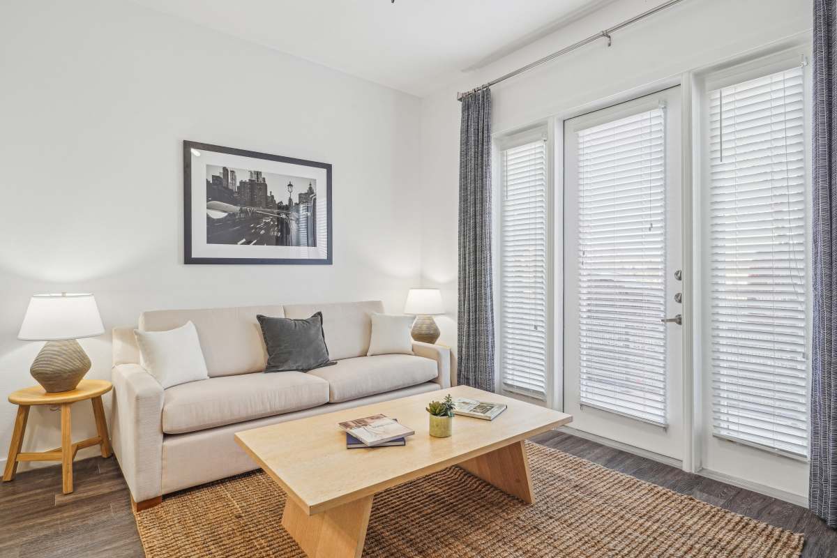 Living room with hard wood style flooring at Century Medical District, Dallas, Texas