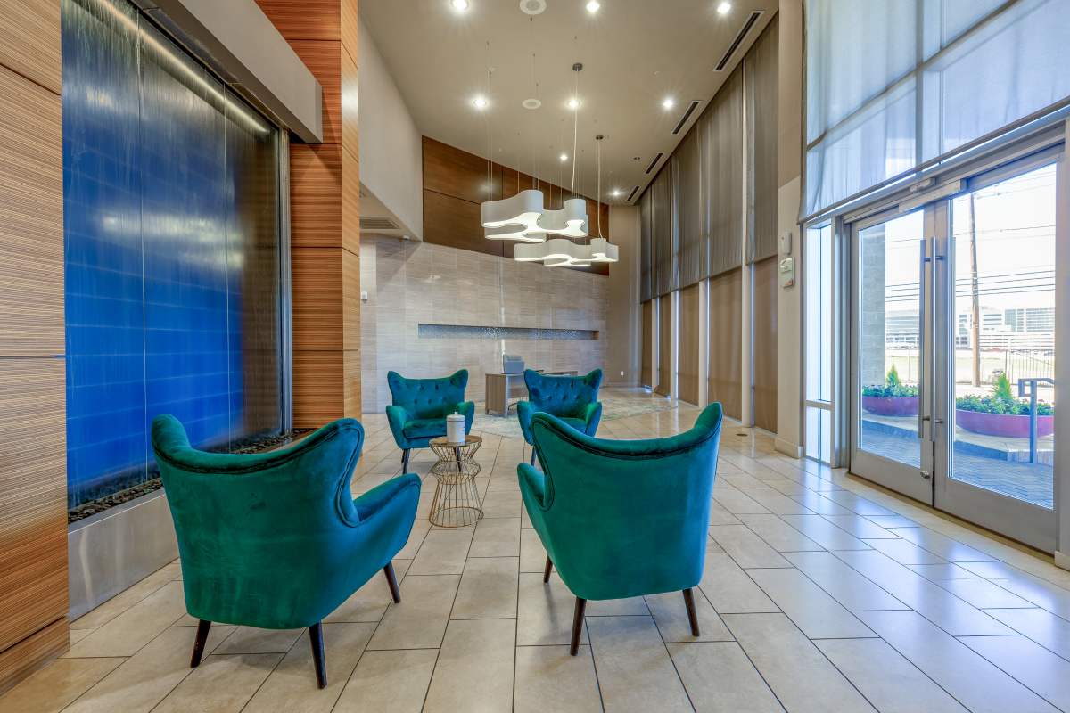 Well-lit lounge area in the clubhouse at Century Medical District in Dallas, Texas