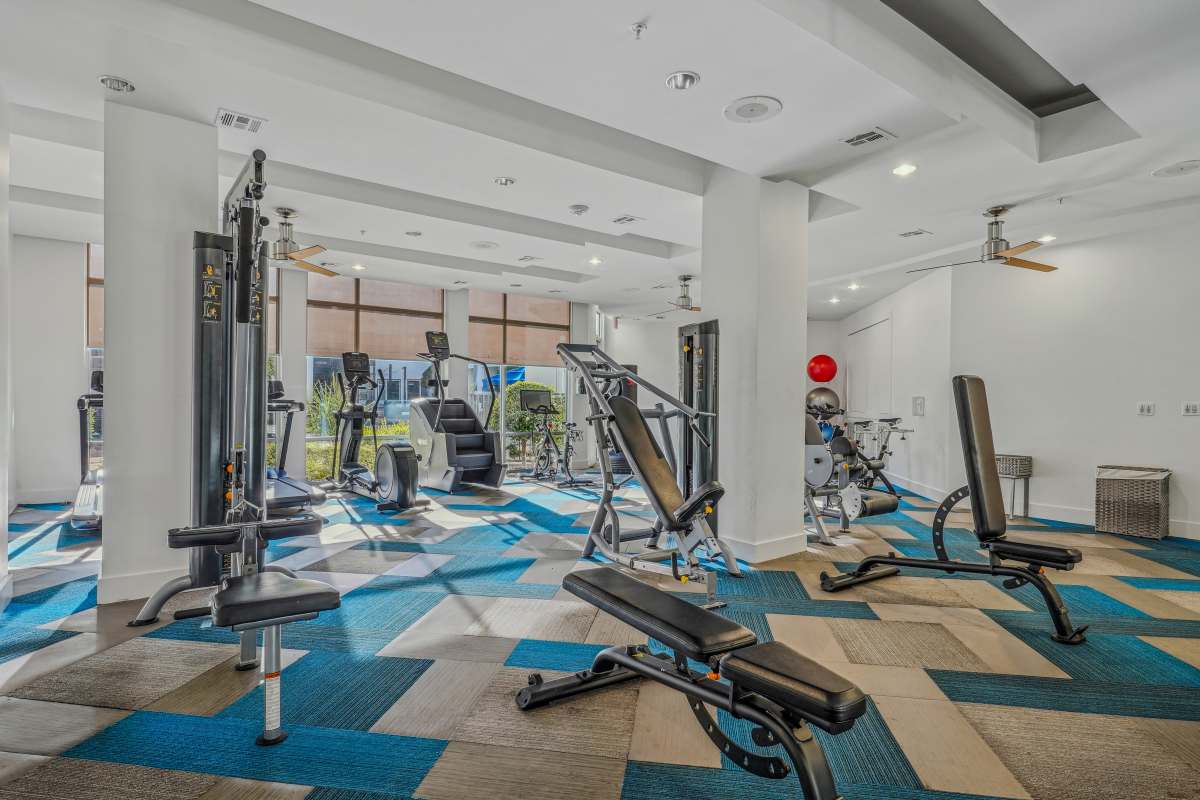 Community fitness center with various equipment at Century Medical District in Dallas, Texas