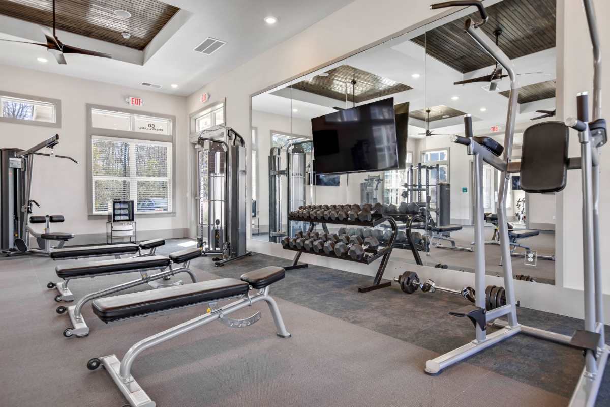 Fitness center with television  at South City Apartments in Summerville, South Carolina