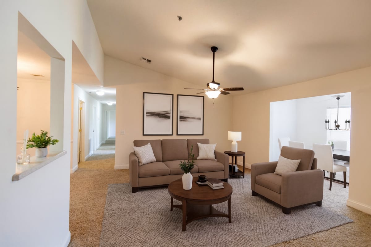 Living room with ceiling fan at Rosewood at Aiken in Aiken, South Carolina