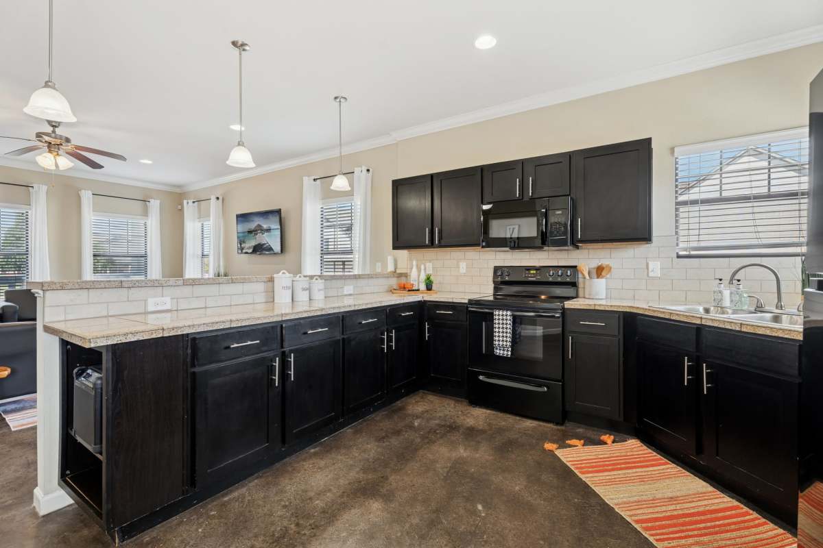 Apartment kitchen at Cottage Row Stillwater in Stillwater, Oklahoma