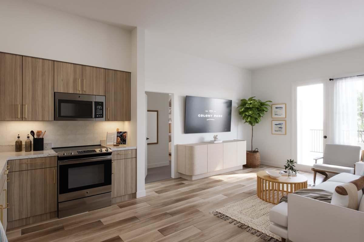 Modern kitchen and sunlit living room with stylish decor at Colony Parc in Ventura, California