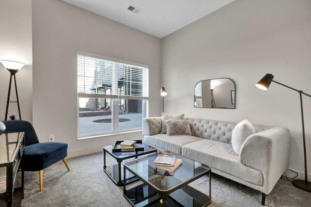 Living room with modern furniture at Gateway Lofts in Lansing, Michigan