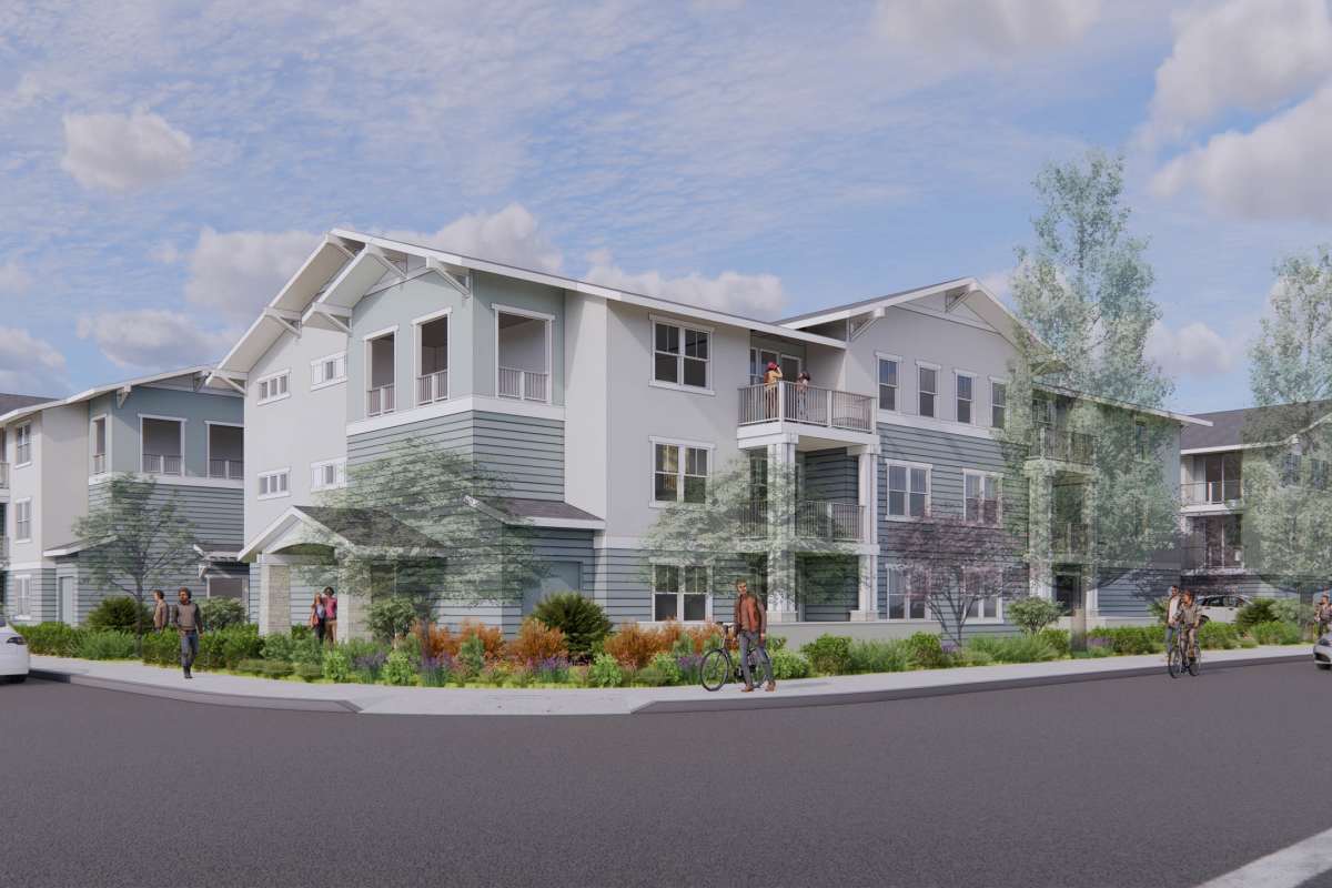 Modern multi-unit building with lush landscaping at Colony Parc in Ventura, California