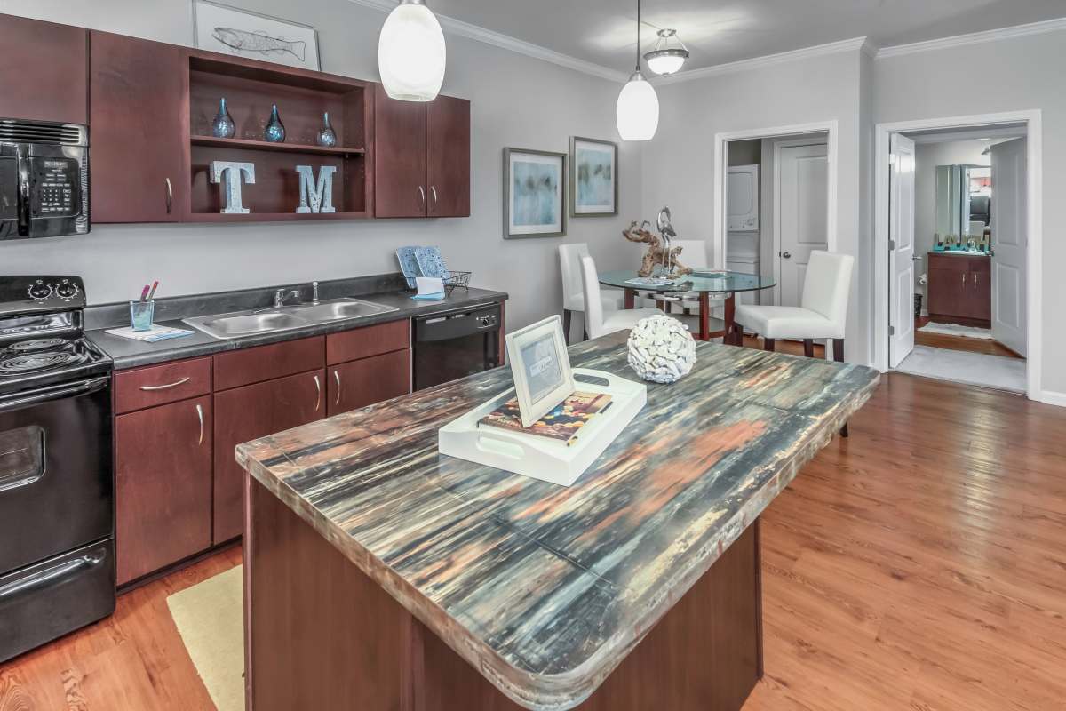 Apartment dining area and kitchen at The Mills Apartment Homes in Greenville, South Carolina