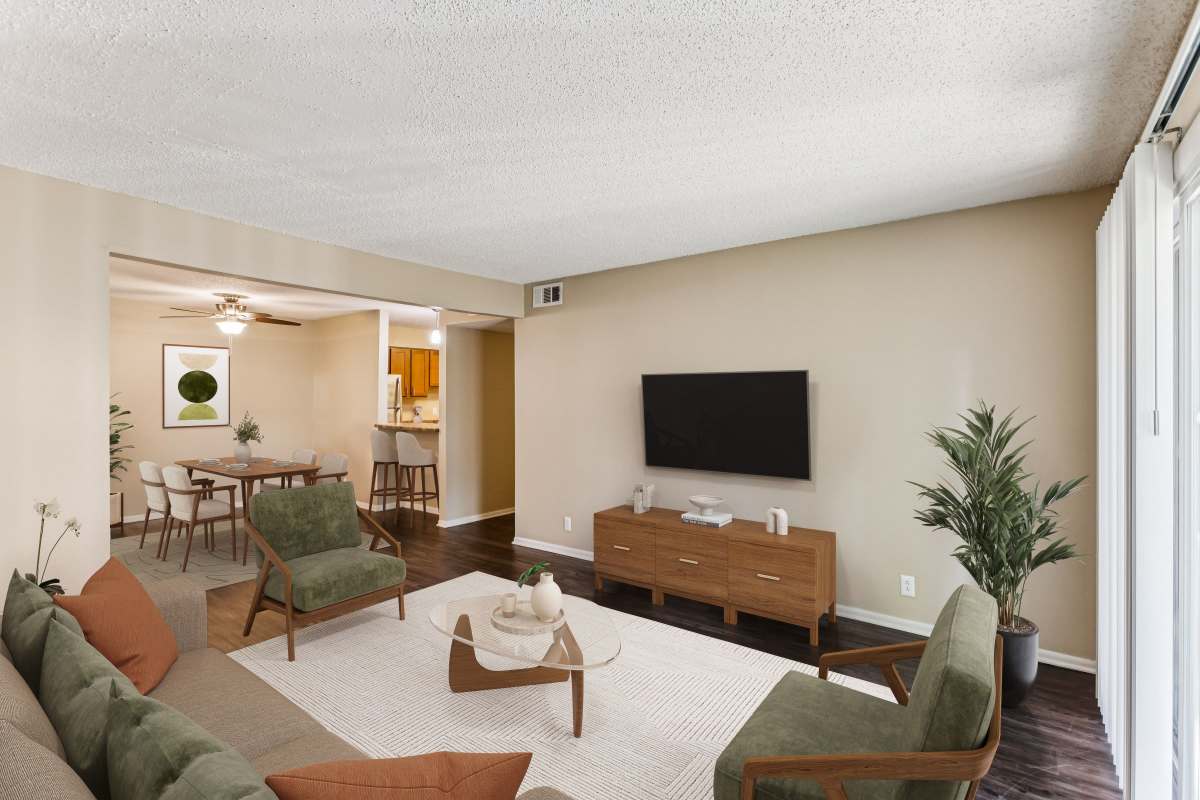 Model living and dining space with natural light at Ashford Place in Clarksville, Tennessee