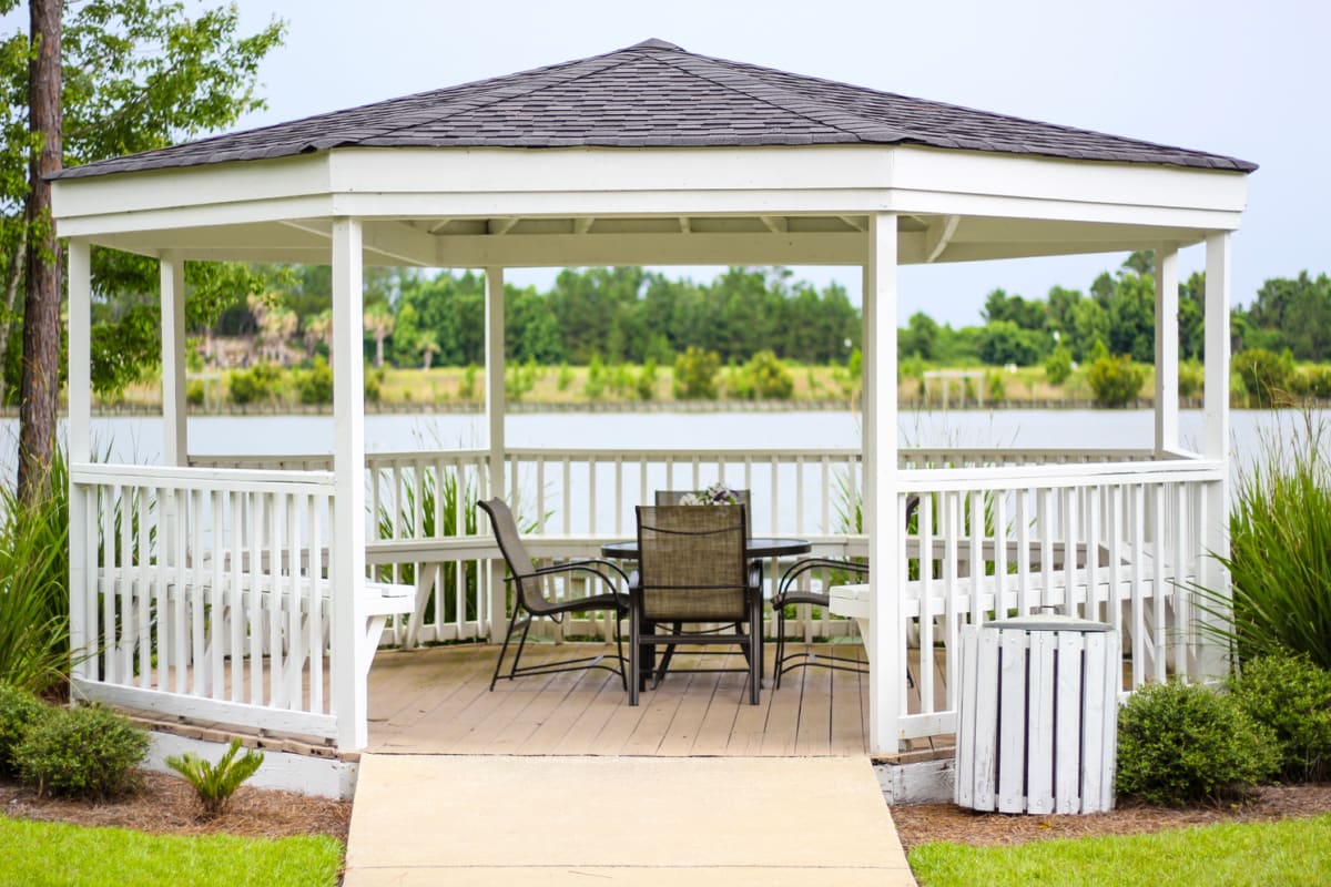 a gazebo with chairs
