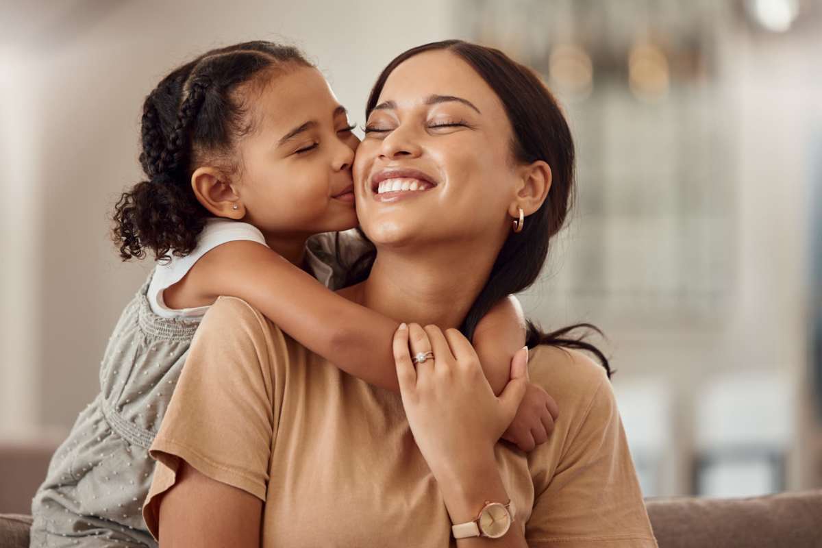 Resident with her daughter in model apartment at Copper Chase in Arlington, Texas