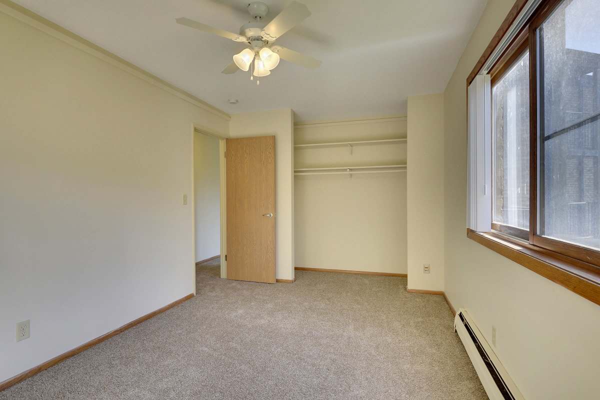Bedroom with closet at Fountain Terrace in New Brighton, Minnesota