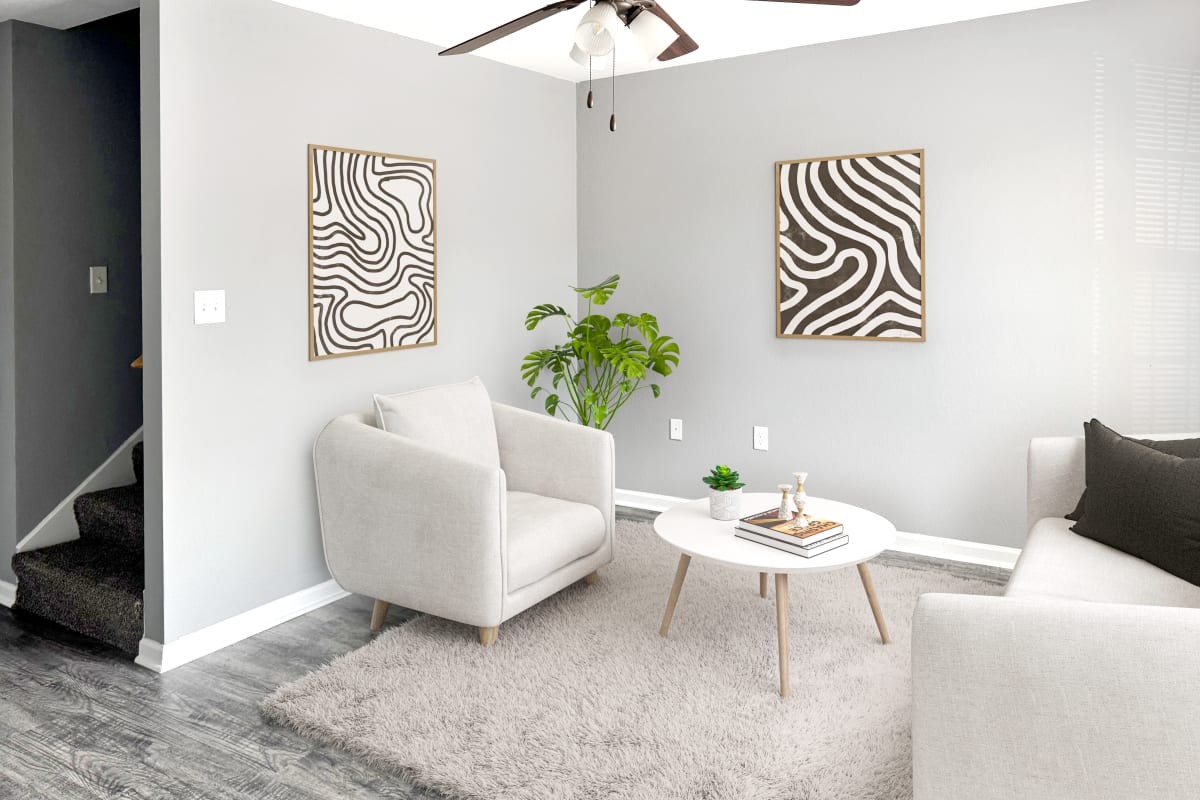 Model living area with stairs at Willow Creek Townhomes in Jonesboro, Arkansas