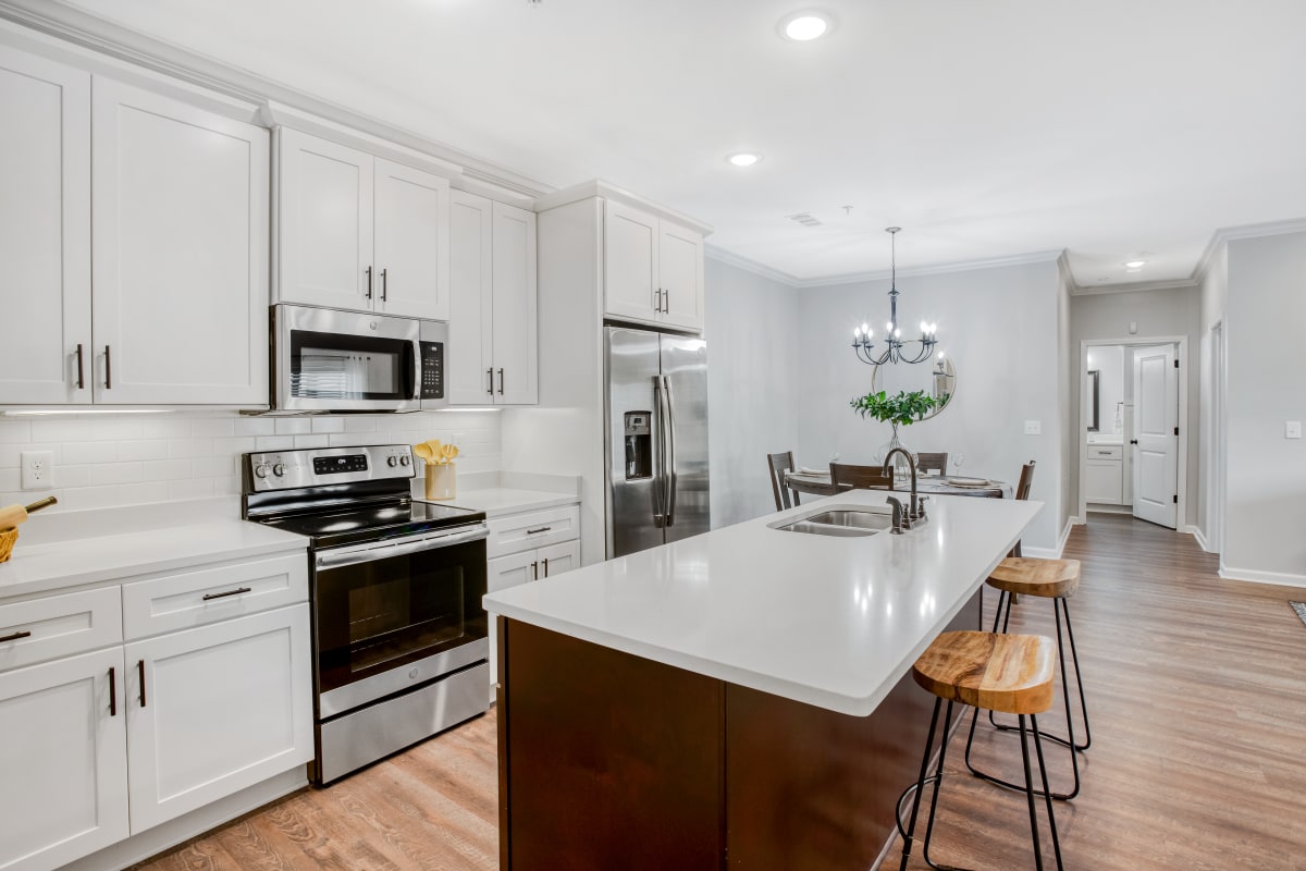 Modern kitchen with white accents at The Landing at Greensborough Village in Jonesboro, Arkansas