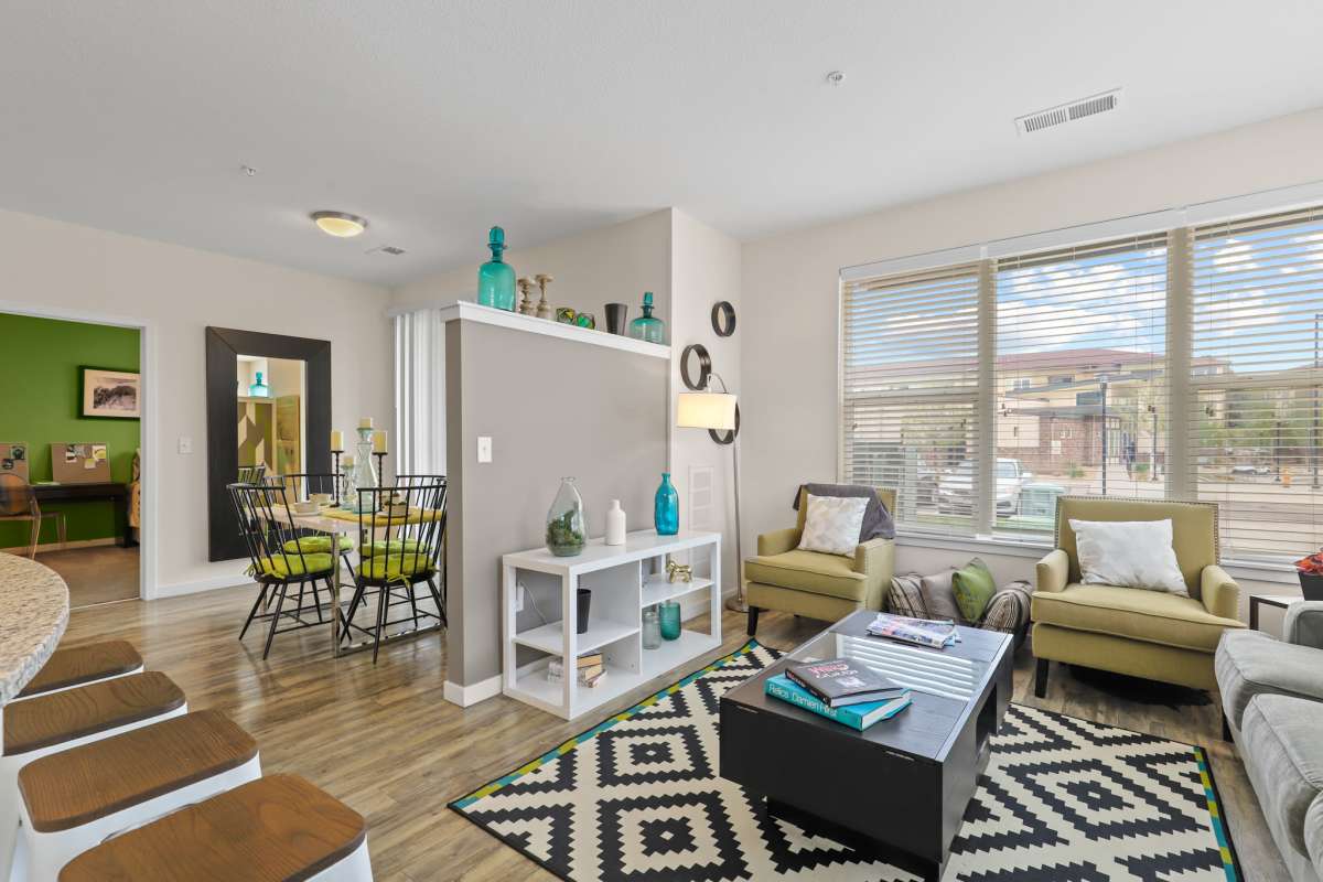Living room with full height window at Westlink at Oak Station Apartments in Lakewood, Colorado 