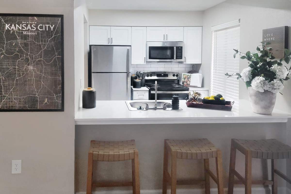 Modern kitchen with upgraded appliances at Casa De Fuentes in Overland Park, Kansas