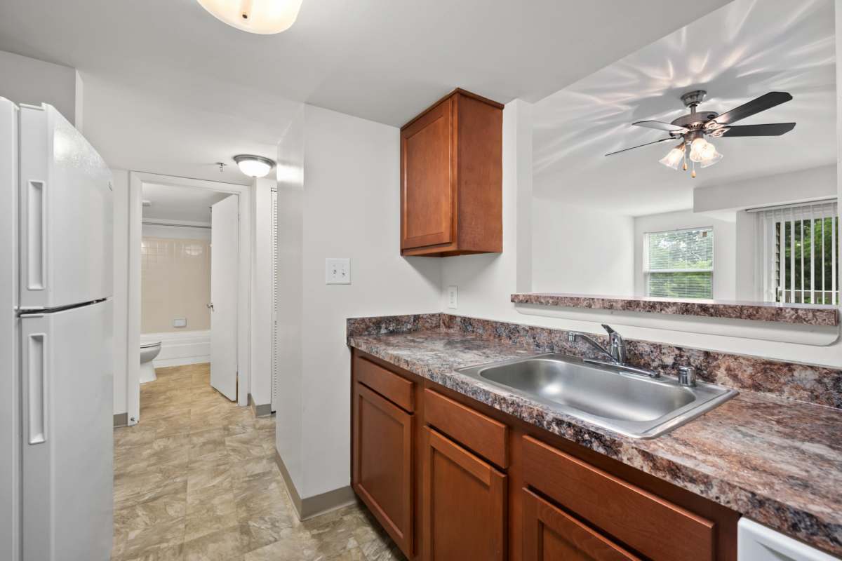 Kitchen with a dishwasher at Rollingcrest Commons in Hyattsville, Maryland       
