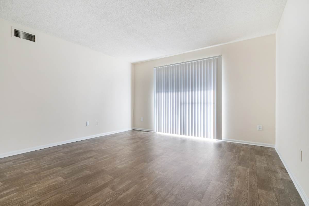 Spacious living area with attached balcony in apartment at The Retreat at Hidden Bay in St. Marys, Georgia