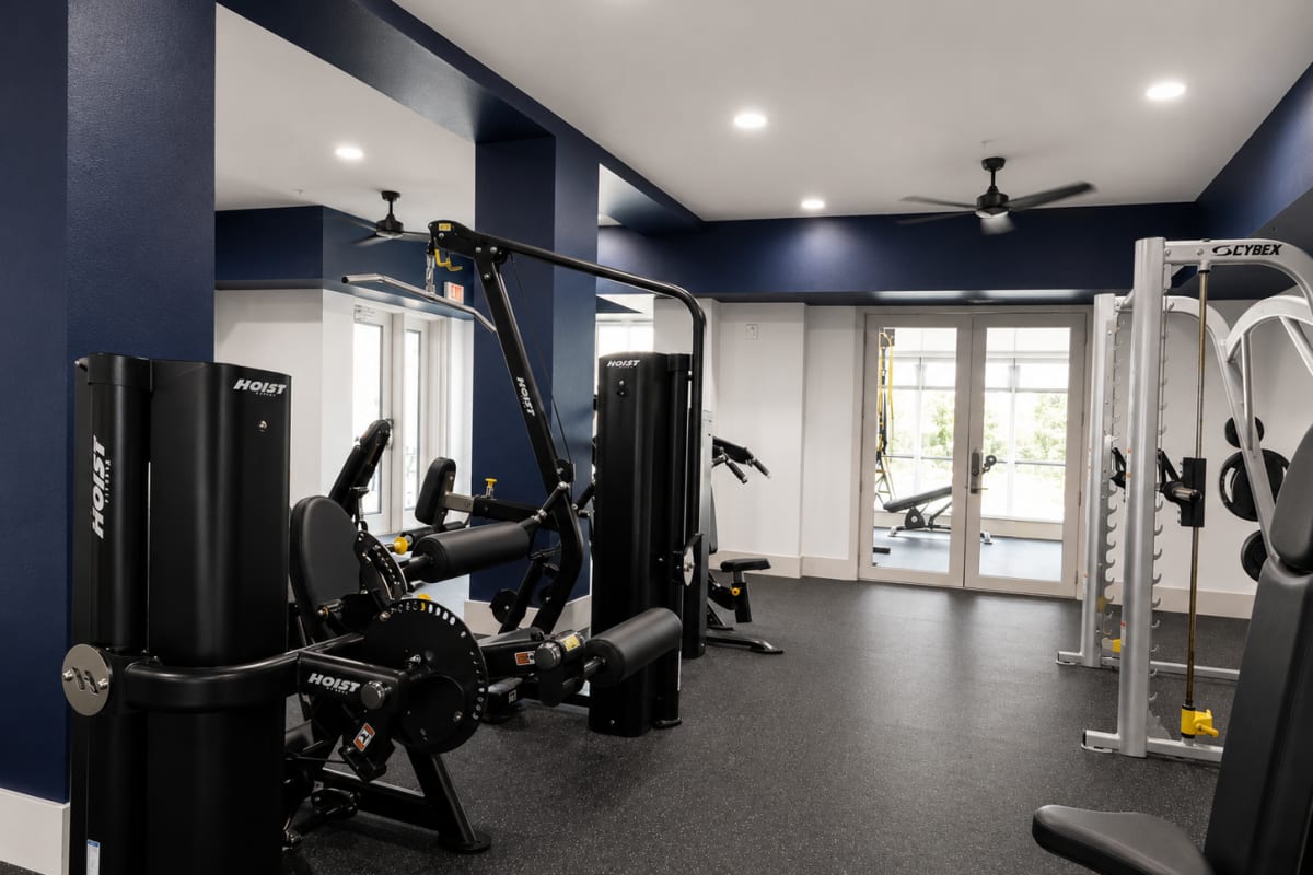 Fitness center with strength training equipment at The Den in Columbia, Missouri