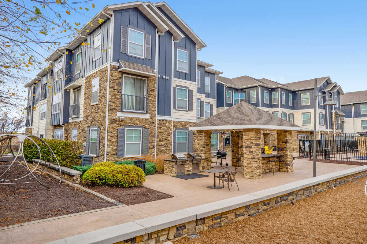 Student housing clubhouse exterior and covered entry at The Den in Columbia, Missouri