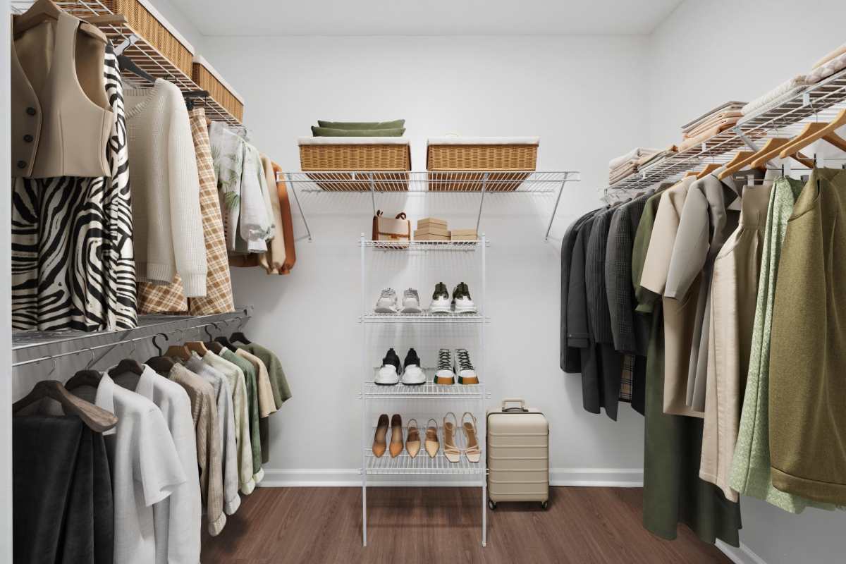 Spacious closet with various mixed clothing items and storage spaces