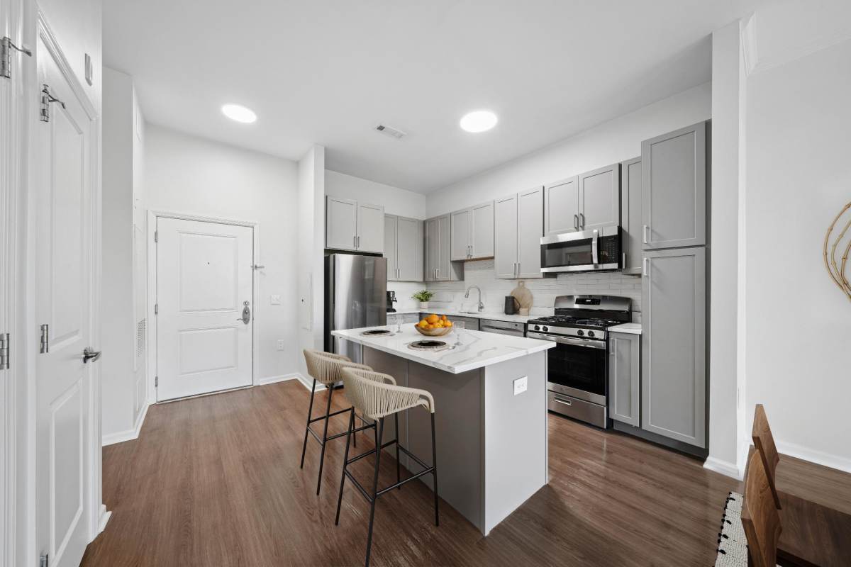 Newly renovated kitchen space with island for eating and entertainment