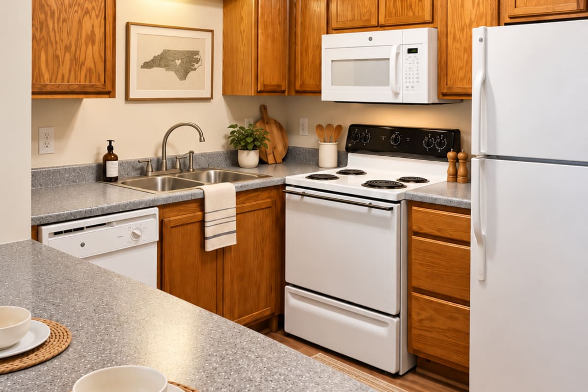 Kitchen with open space to the living room at Lodge at Lakeshore in Greensboro, North Carolina