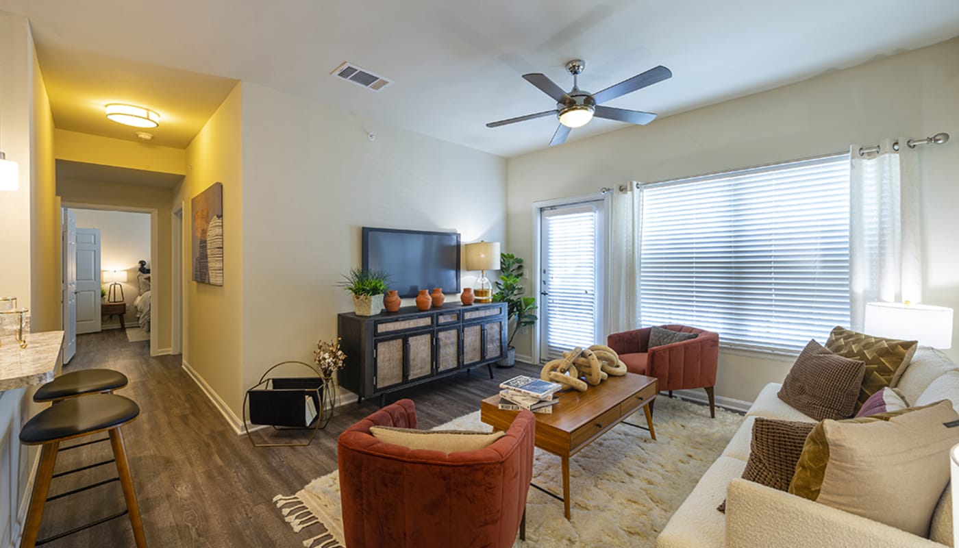 Model apartment living room at Brazos Crossing in Richwood, Texas