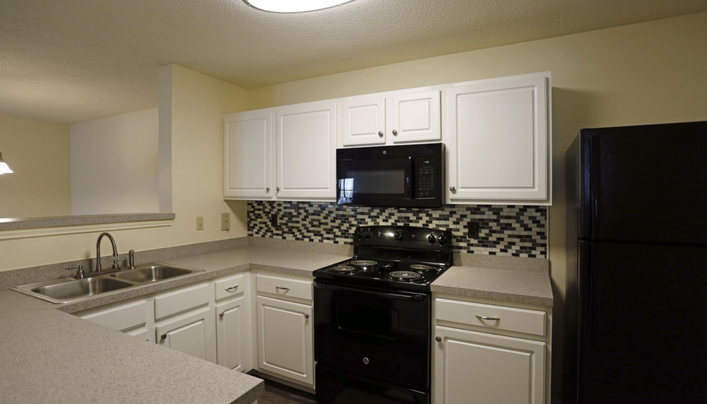 Apartment kitchen at Camellia Trace in Jackson, Tennessee