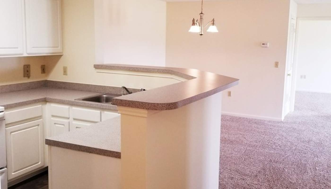 Kitchen area with white cabinetry at Camellia Trace in Jackson, Tennessee