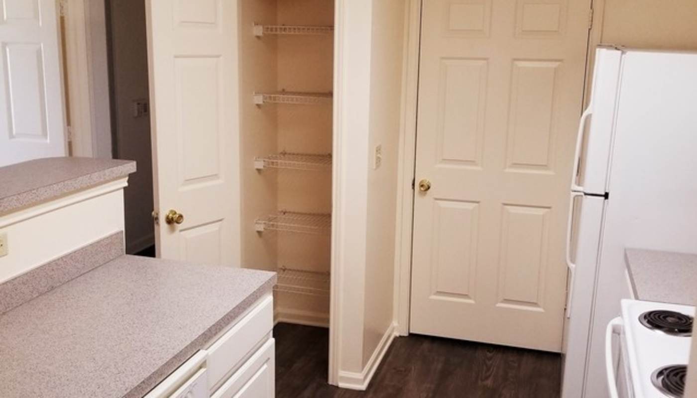 Apartment kitchen with storage at Camellia Trace in Jackson, Tennessee