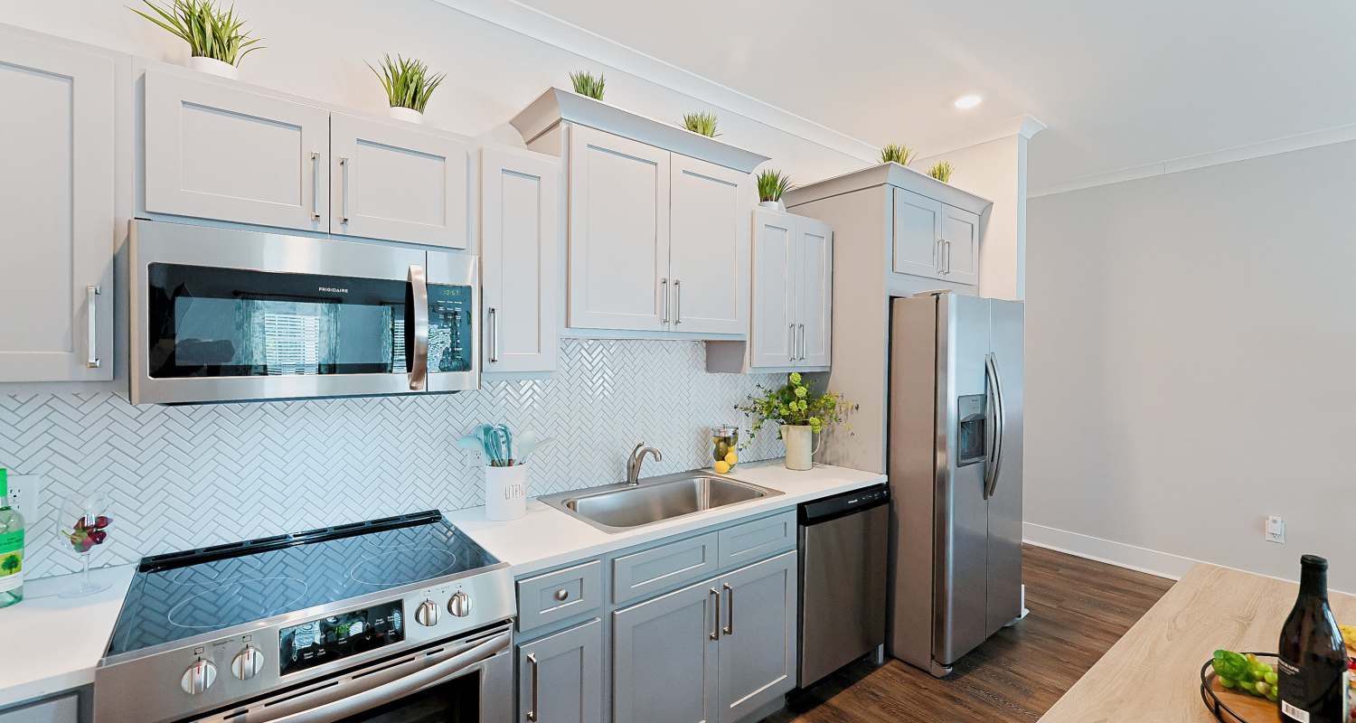 Furnished kitchen with stainless-steel appliances at Beverly Villas in Brunswick, Georgia