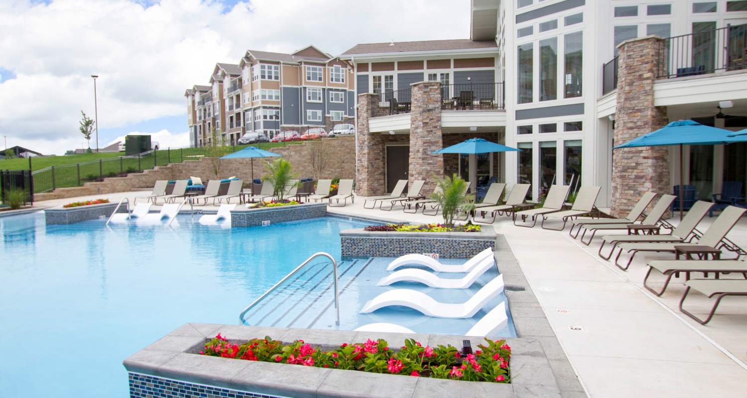 pool with chairs at The Residences at New Longview in Lee's Summit, MO